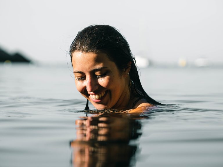 Why should we not swim with contact lenses?