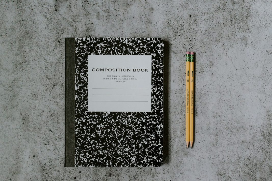 Notebook and pencils representing preparation for an adult ADHD assessment