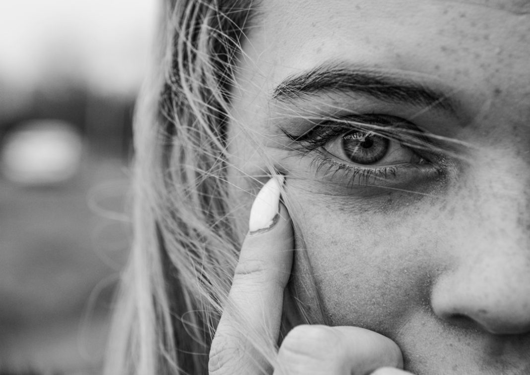 Close-up portrait illustrating contact lens eye care