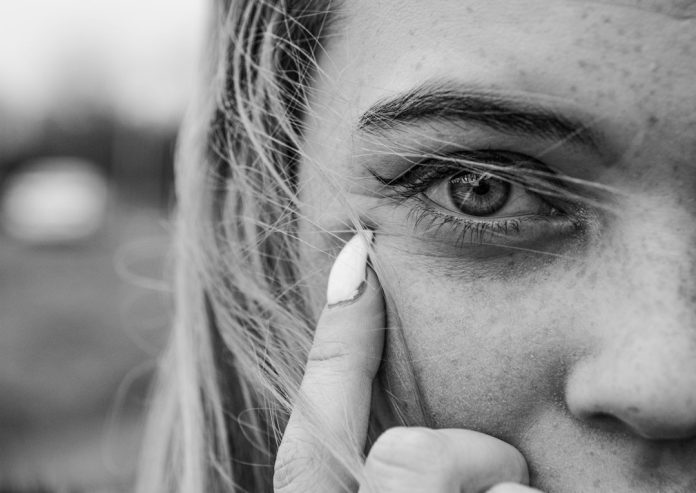 Close-up portrait illustrating contact lens eye care