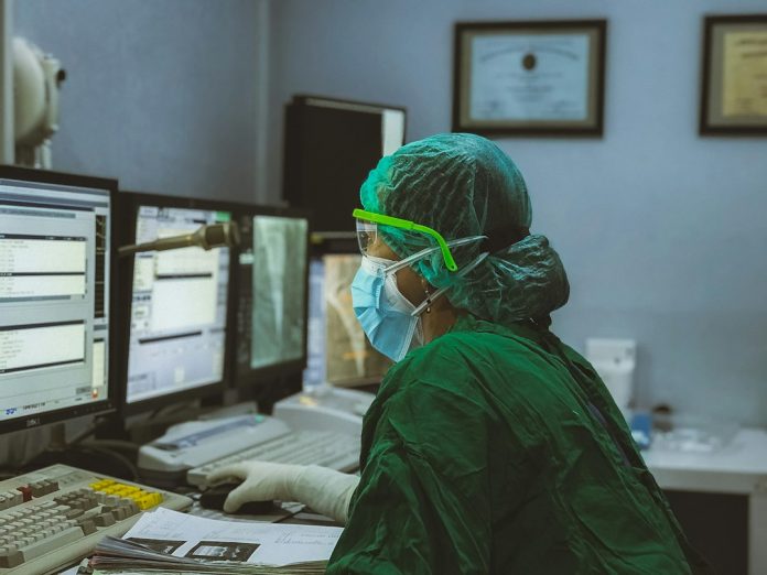 Health professional working at a hospital control room
