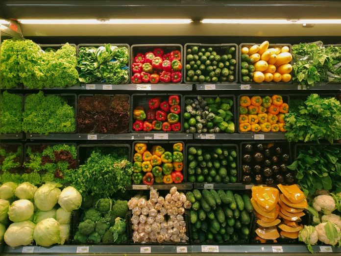 Fresh vegetables displayed at a grocery market