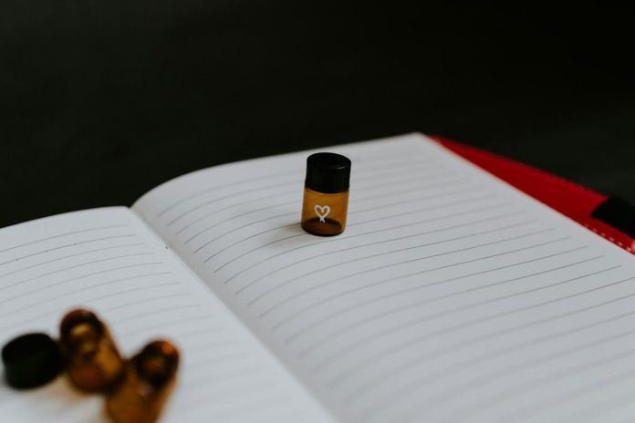 Medicine bottle resting on lined paper for a medication review
