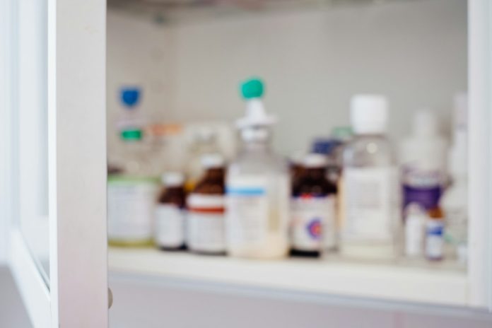 Medicine bottles arranged for a home medicine-cabinet review