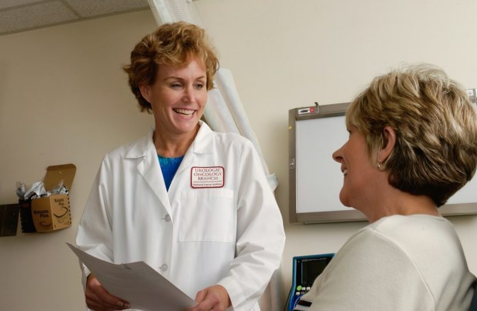 Clinician discussing preventive screening with a patient — photo by National Cancer Institute / Unsplash