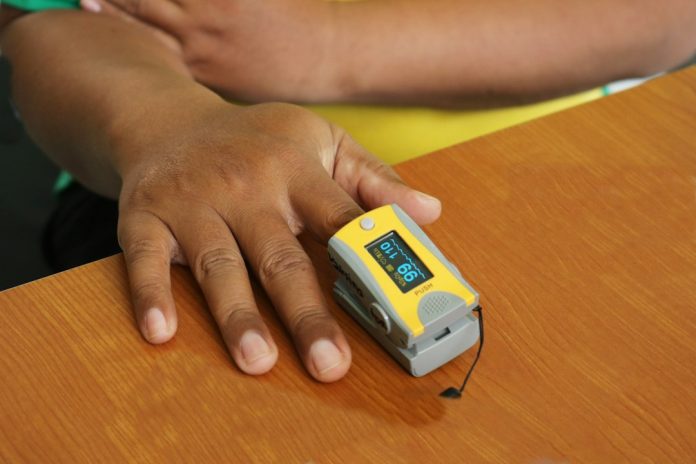 A pulse oximeter used to estimate oxygen saturation at home