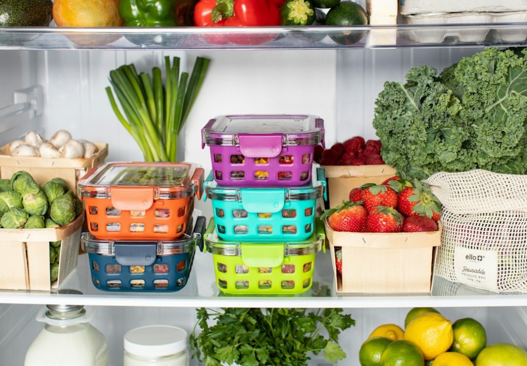 Organized refrigerator with packaged foods and fresh produce for a guide to reading sodium labels