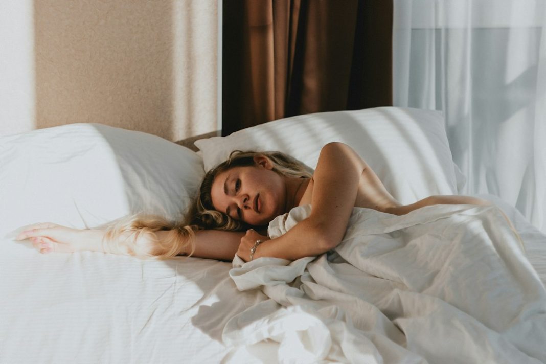 Woman resting in a calm bedroom