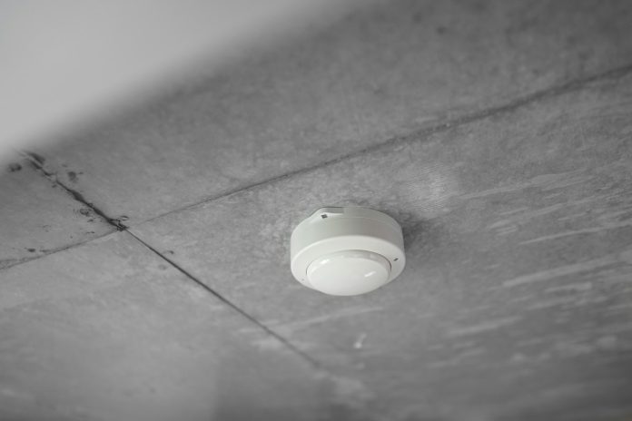 Smoke alarm installed on a home ceiling