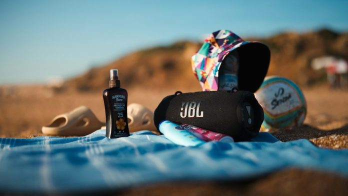 Sunscreen and summer essentials arranged for sun protection