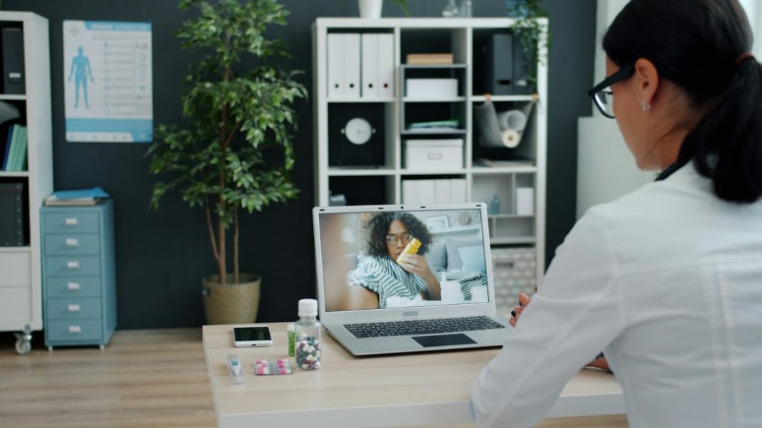 Patient preparing for a telehealth video appointment at home