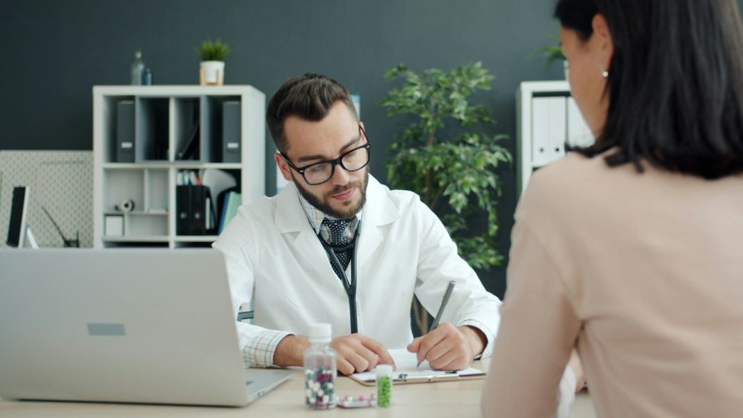 Doctor reviewing kidney test results with a patient